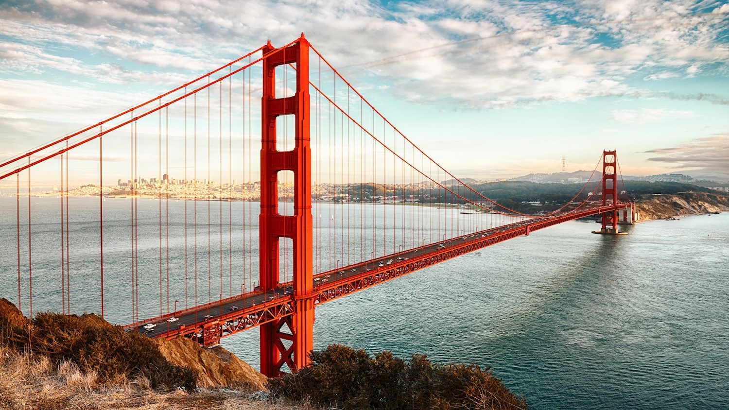 Peer through the fog at the towers of Golden Gate Bridge