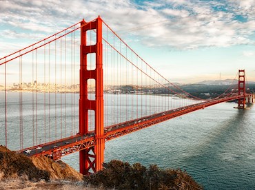 Peer through the fog at the towers of Golden Gate Bridge