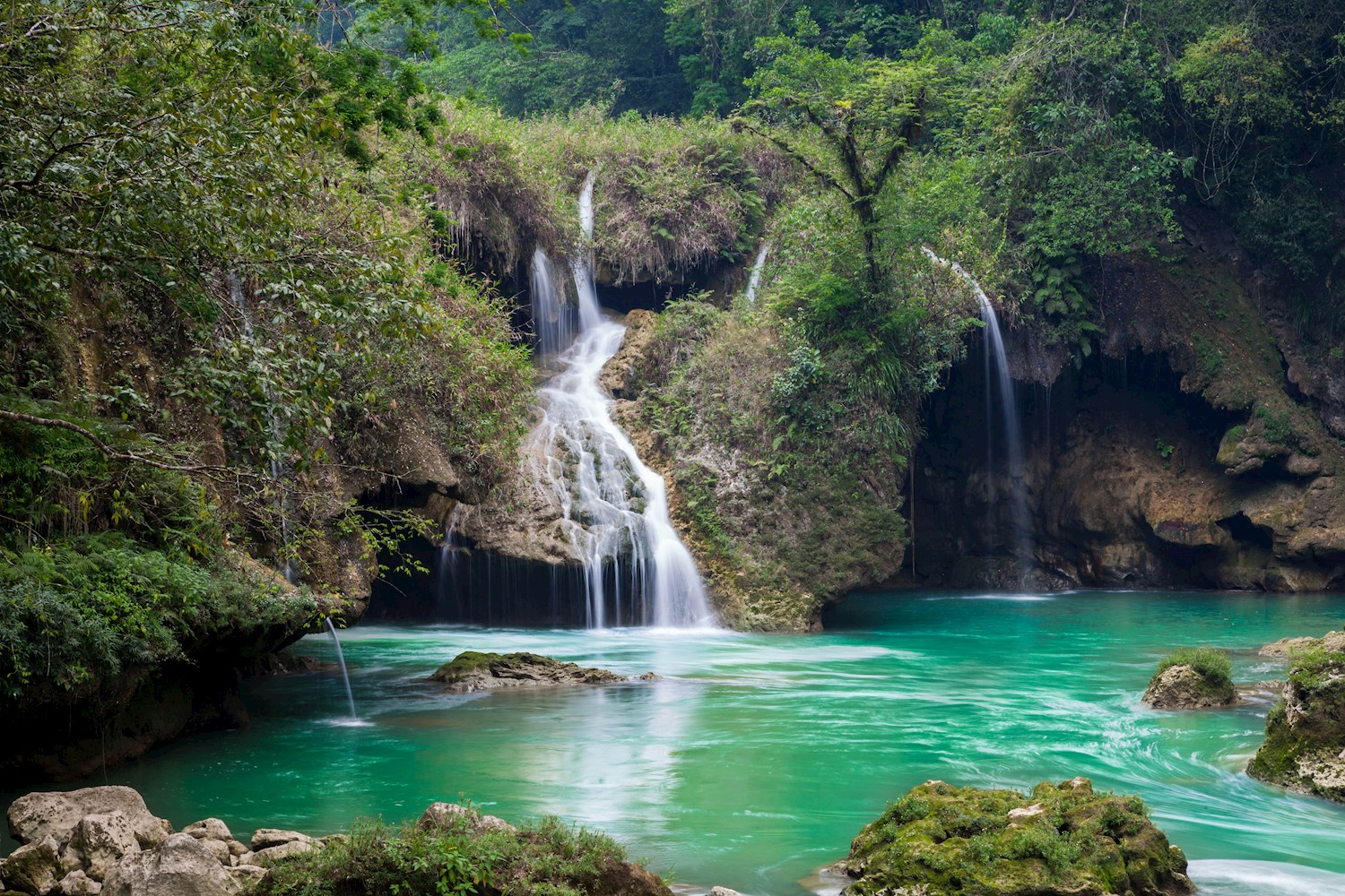 Cool off in the jungle-shrouded Swimming hole of Semuc Champey